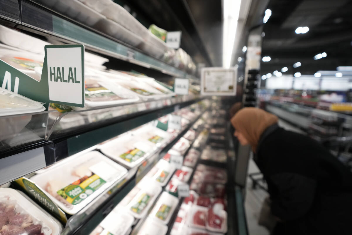 A women shops in the halal food section inside a Metro grocery store in Milton, Ont., on Friday, January 12, 2024. THE CANADIAN PRESS/Nathan Denette