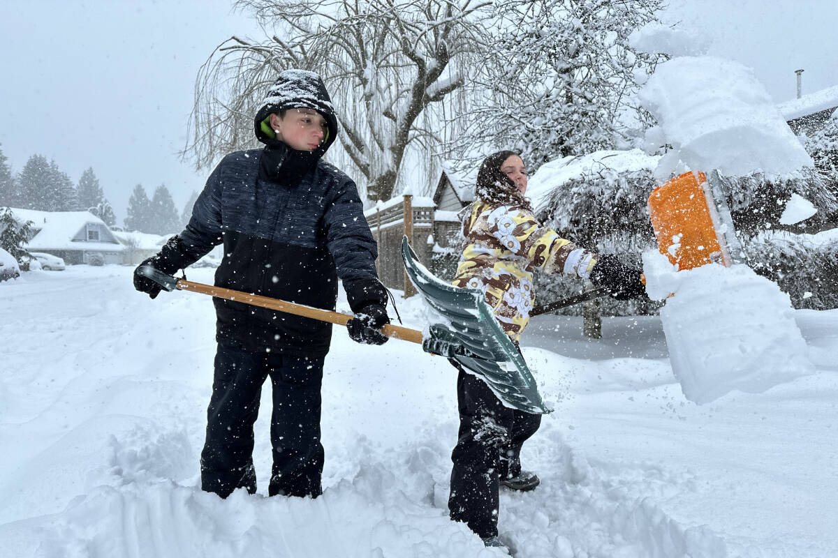 Neila and Noah Rozander were off school but still working hard shovelling the deep snow in their Langley City neighbourhood Wednesday, Jan. 17, 2024. (Heather Colpitts/Langley Advance Times)