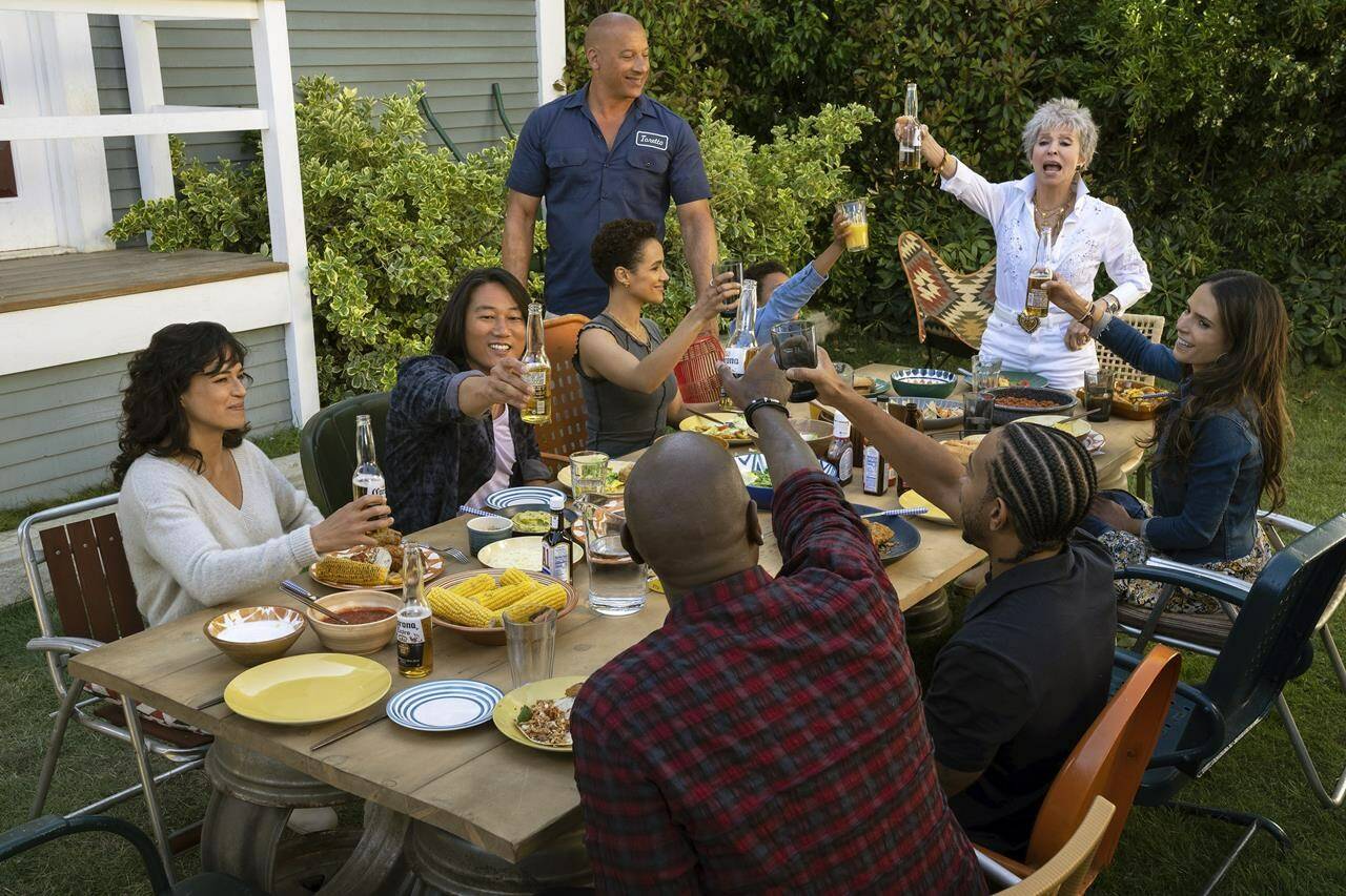 This image released by Universal Pictures shows, clockwise from left, Michelle Rodriguez, Sung Kang, Nathalie Emmanuel, Vin Diesel, Leo Abelo Perry, Rita Morena, Jordana Brewster, Ludacris and Tyrese Gibson in a scene from “Fast X.” (Peter Mountain/Universal Pictures via AP)