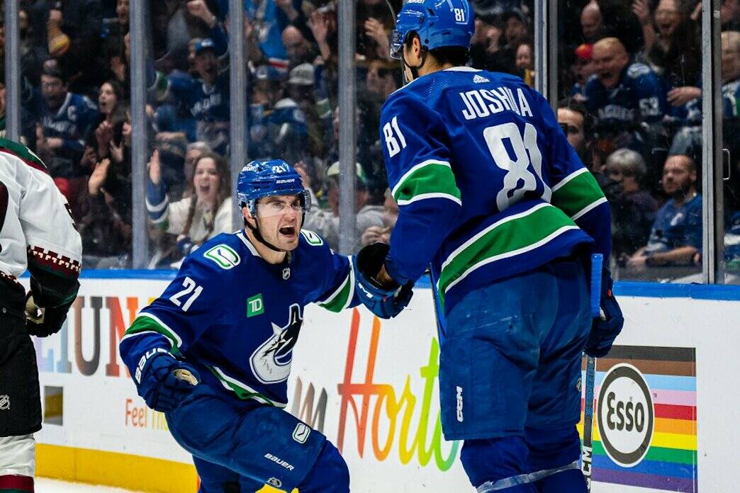 Vancouver’s Nils Hoglander celebrates with teammate Dakota Joshua after a goal during the game against the Arizona Coyotes Thursday night at Rogers Arena. Joshua’s goal late in the second period would give the Canucks a 2-1 win over the visitors. Vancouver Canucks photo