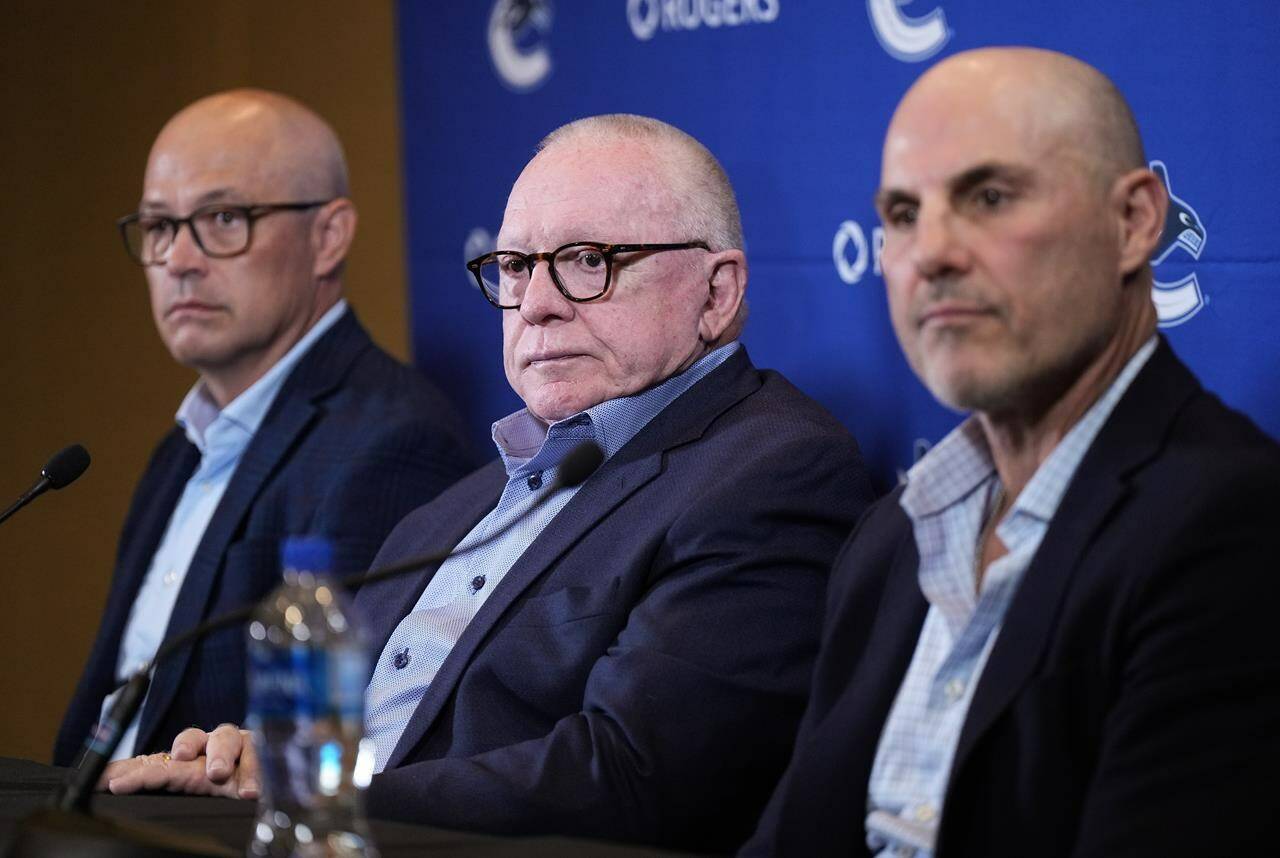 The Vancouver Canucks have signed president of hockey operations Jim Rutherford to a multi-year contract extension. Rutherford, centre, general manager Patrik Allvin, back left, and head coach Rick Tocchet listen during a news conference in Vancouver, B.C., Wednesday, Sept. 20, 2023. THE CANADIAN PRESS/Darryl Dyck