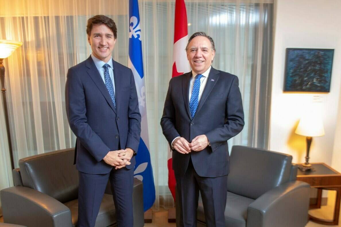 Quebec Premier François Legault is asking Prime Minister Justin Trudeau to slow down the influx of asylum seekers entering his province, which he said is nearing a "breaking point." Trudeau and Legault pose for photos in Montreal, Friday, Dec. 13, 2019. THE CANADIAN PRESS/Ryan Remiorz