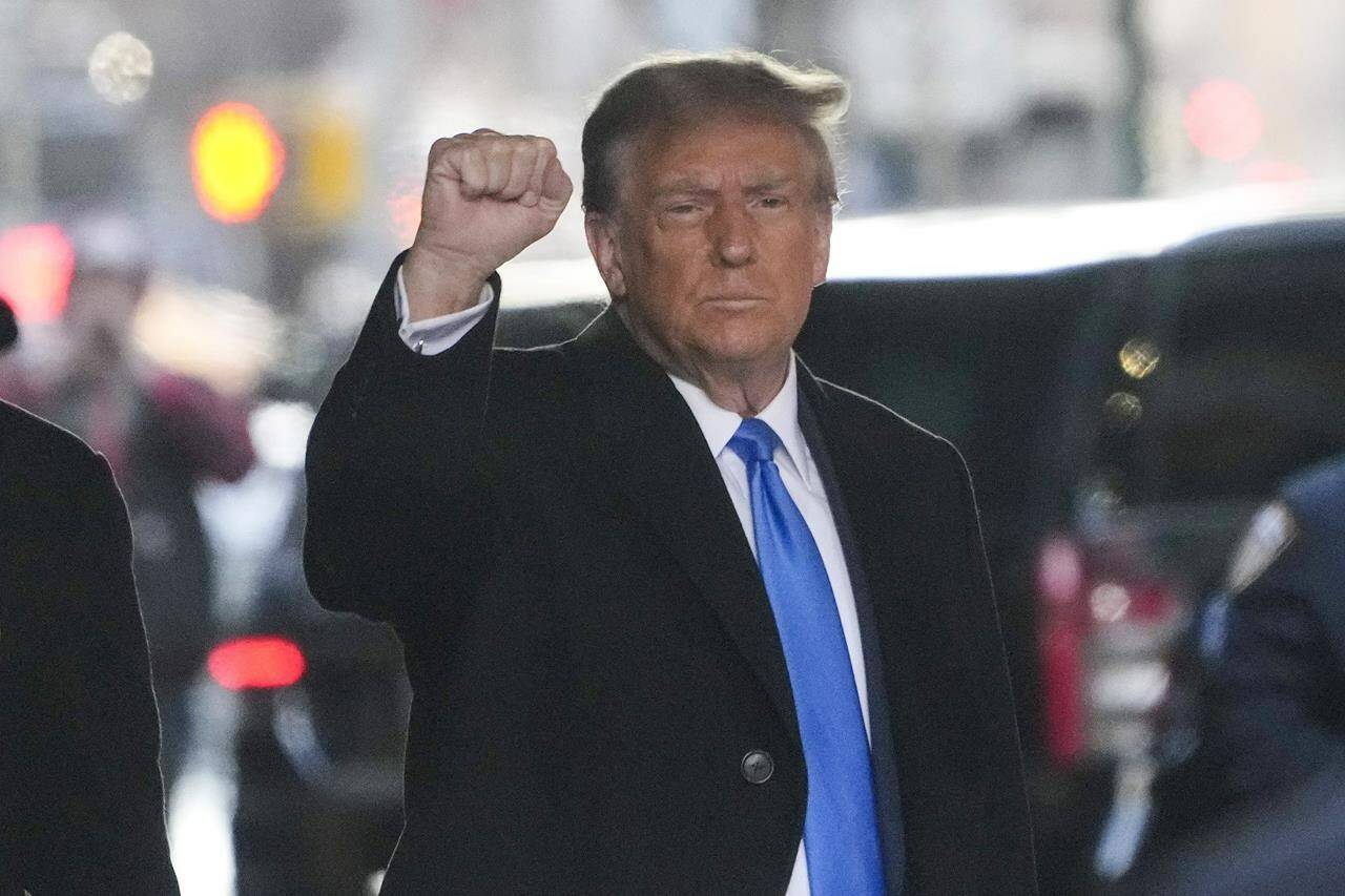 Former President Donald Trump leaves his apartment building in New York, Monday, Jan. 22, 2024. (AP Photo/Seth Wenig)