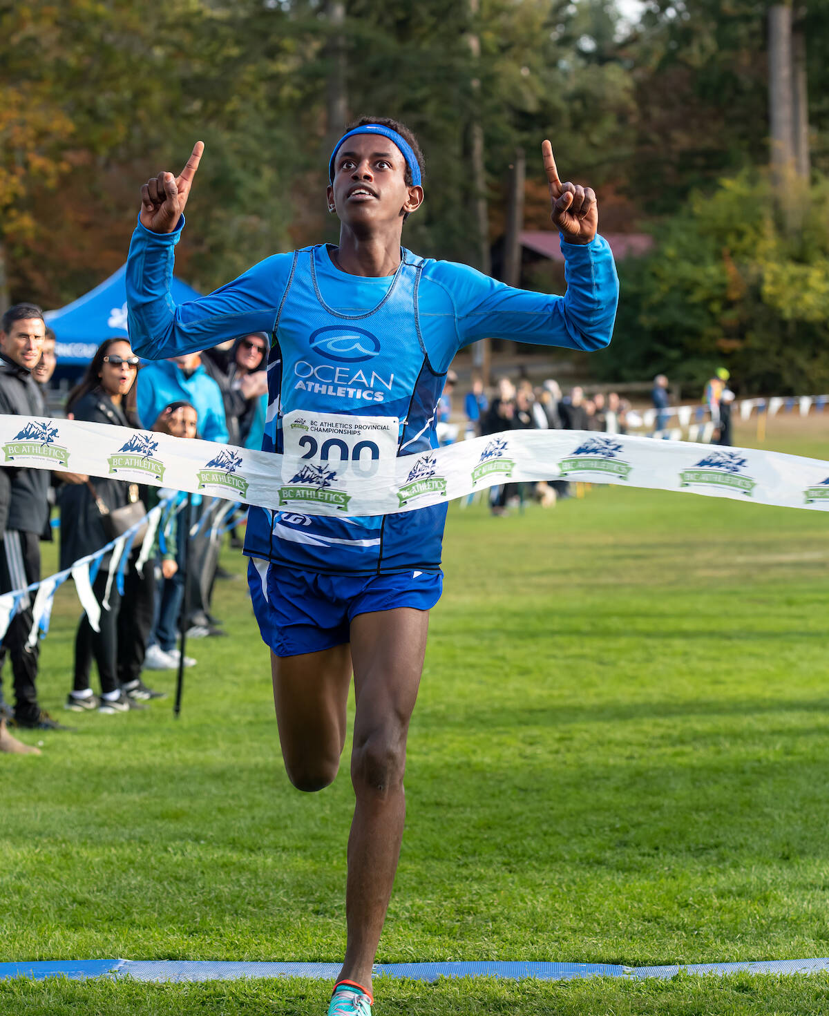 Track athlete Yemane Mulugeta, a student at L.A. Matheson Secondary in Whalley, crosses the finish line during a recent race. (Photo courtesy Sport BC)