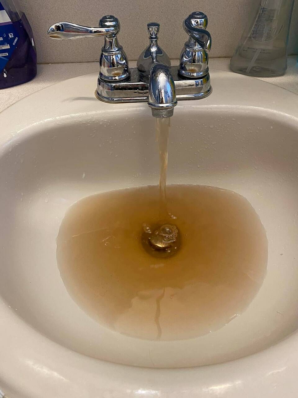 In April 2022, a resident living on Maple Street in Osoyoos posted this picture, saying the water coming out was brown and sandy. The Town says demand for domestic water supply has them looking at various sources. (Facebook)