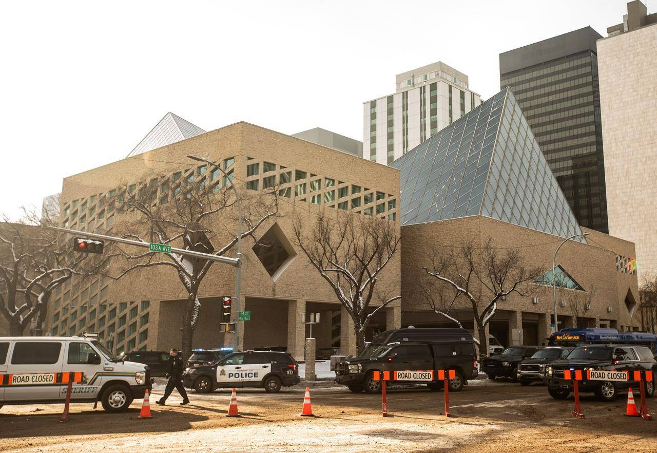 Police were investigating a shooting Tuesday at Edmonton City Hall, where a Molotov cocktail was also thrown from the building’s second floor. Police surround city hall during an investigation, in Edmonton, Tuesday, Jan. 23, 2024. THE CANADIAN PRESS/Jason Franson