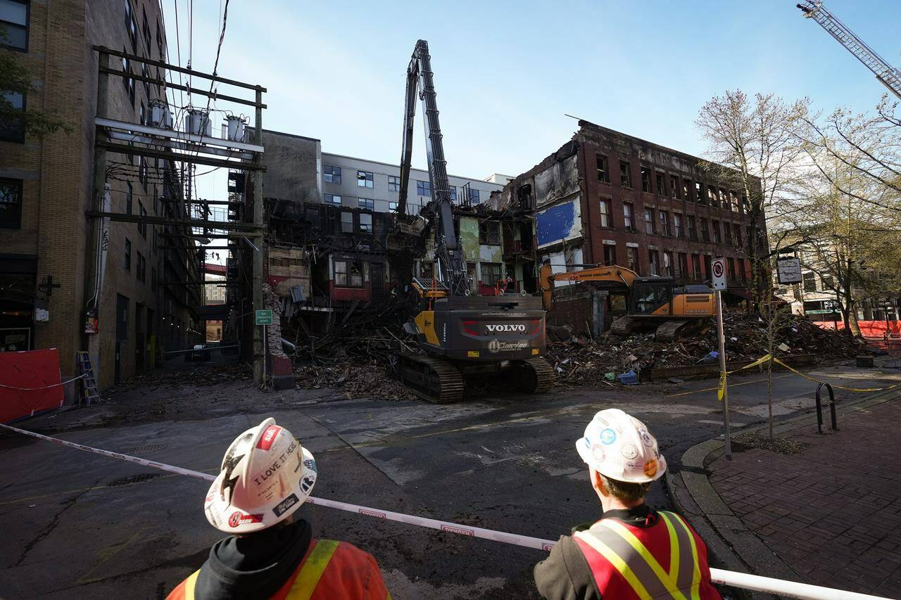 The manager of a downtown Vancouver rooming house that was the site of a fatal fire in 2022 broke down in tears at an inquest, telling the jury that staff needed better training in fire safety. An April 11 fire gutted the building, killing Mary Ann Garlow, 63, and Dennis Guay, 53, whose remains were found more than a week later when the building was being demolished. The Winters Hotel is demolished in Vancouver, B.C., Friday, April 22, 2022. THE CANADIAN PRESS/Darryl Dyck