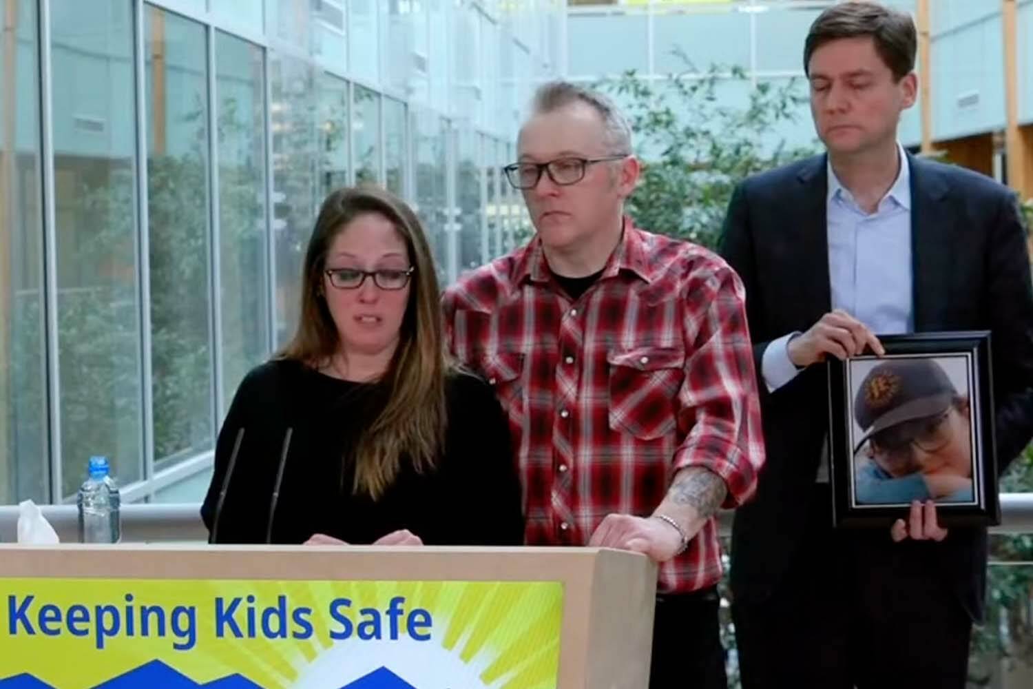 Nicole Smith and Ryan Cleland, the parents of 12-year-old Carson Cleland who died of suicide after falling victim to online sextortion in October 2023, joined Premier David Eby Friday in Surrey, where he announced a series measures promising to stop the harmful effects of digital technology. (Screencap)