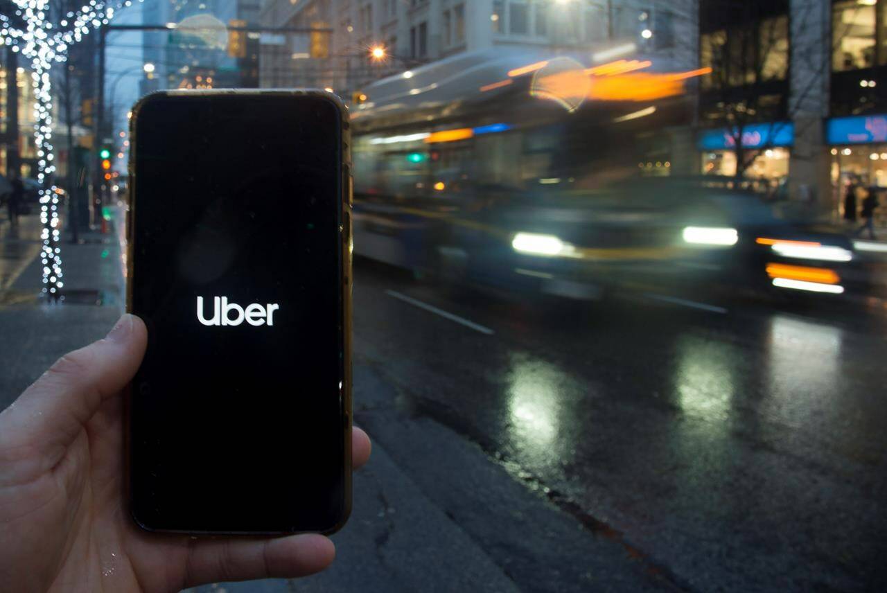 The Uber App is pictured on a smart phone in downtown Vancouver, B.C., Monday, December 30, 2019. THE CANADIAN PRESS/Jonathan Hayward