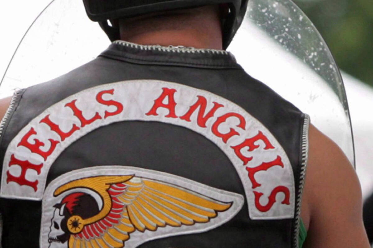 Members of the Hells Angels arrive at a property in Langley, B.C., on July 25, 2008. THE CANADIAN PRESS/Darryl Dyck