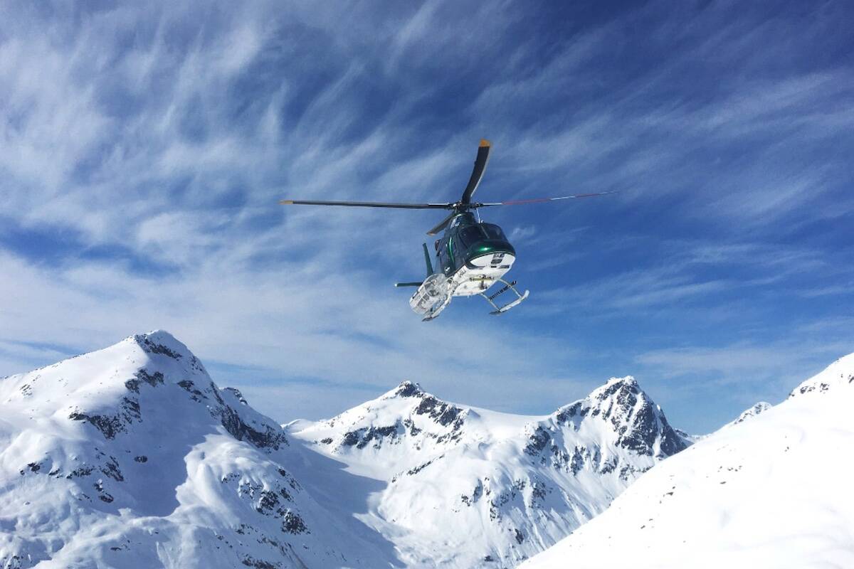 A photo taken from the facebook page of Northern Escape Heli-Skiing that shows a helicopter landing. The head of the heli-skiing company involved in a fatal crash north of Terrace, B.C., last Monday says pilot Mark McGowan was among the four dead. (Northern Escape Heli-Skiing/Facebook)