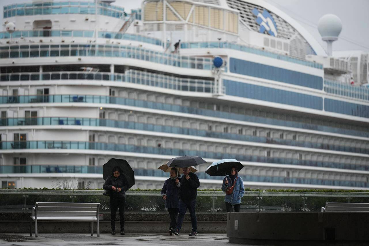 Environment Canada is warning of another torrent of heavy rain in southwestern British Columbia in the latest atmospheric river to wash over the region. People use umbrellas to shield themselves from the rain in Vancouver, on Monday, September 25, 2023. THE CANADIAN PRESS/Darryl Dyck