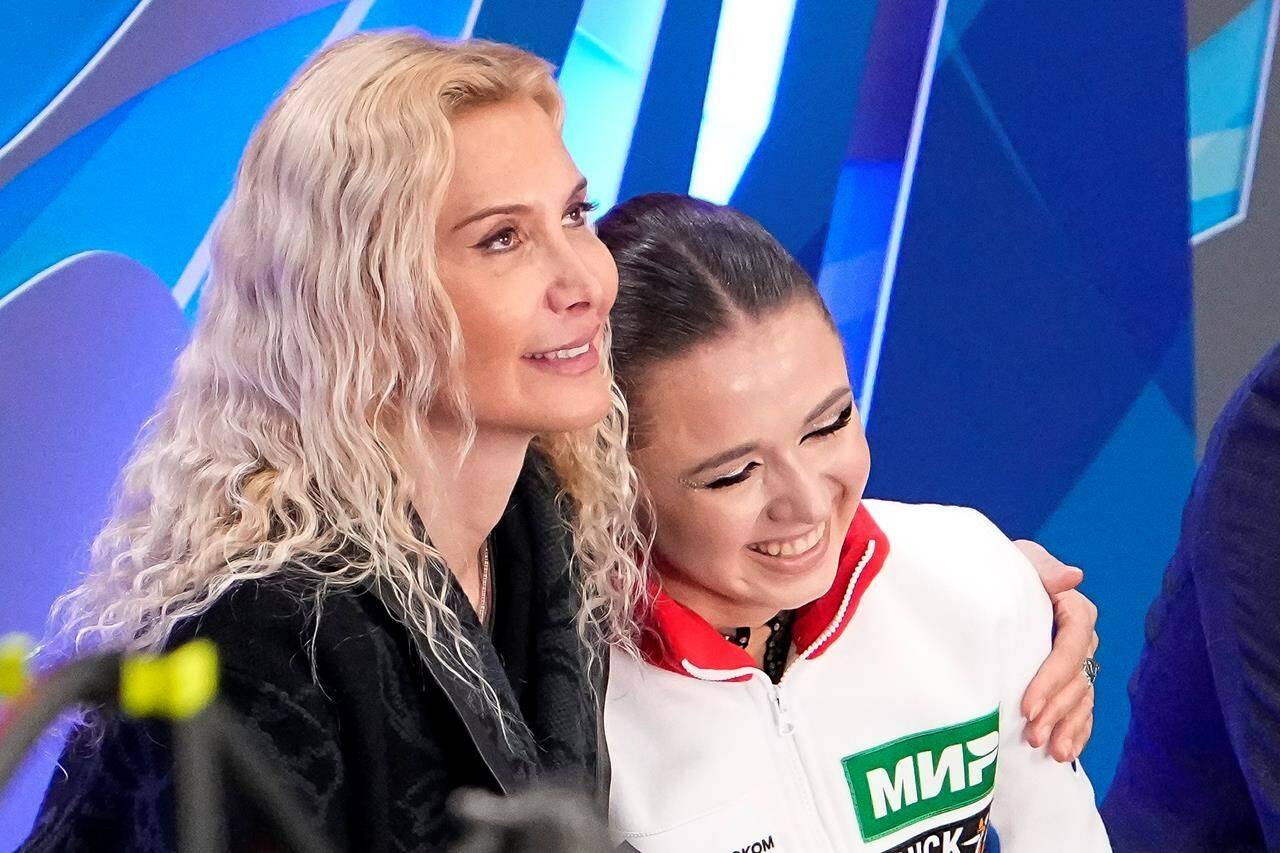 FILE -Russian Kamila Valieva, center, and her coach Eteri Tutberidze, left, react after competing in the women’s free skate program during the figure skating competition at the 2023 Russian Figure Skating Grand Prix in Moscow, Russia, Sunday, Nov. 26, 2023. Russian figure skater Kamila Valieva has been disqualified from the 2022 Beijing Olympics. The verdict from the Court of Arbitration for Sport comes almost two years after Valieva’s doping case caused turmoil at the Beijing Games. (AP Photo/Alexander Zemlianichenko, File)