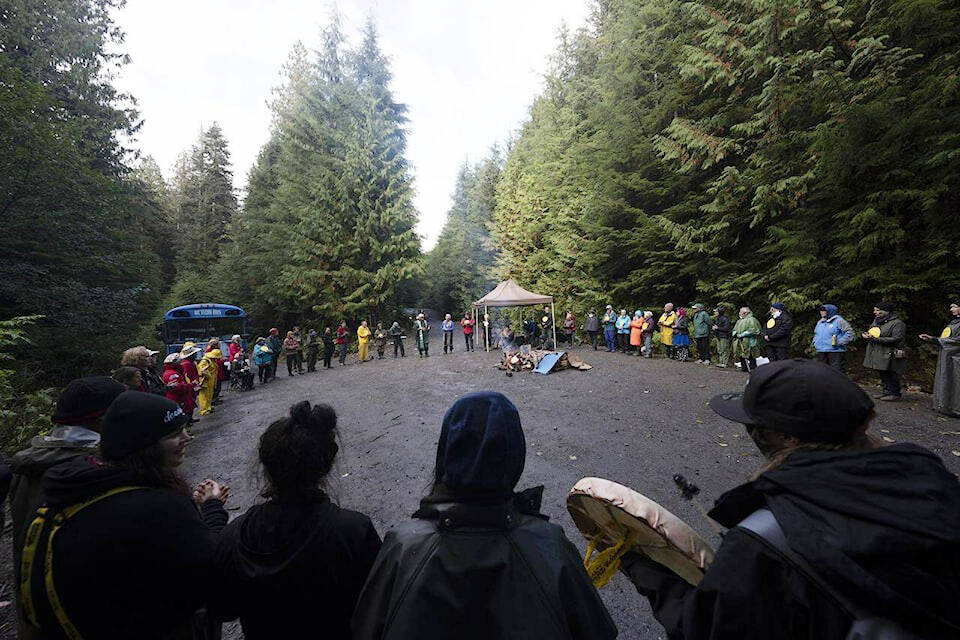 Elders for Ancient Forests along with people declaring themselves “land defenders” take part in a peace circle along a logging road in the Fairy Creek logging area near Port Renfrew, on Oct. 5, 2021. (THE CANADIAN PRESS/Jonathan Hayward)