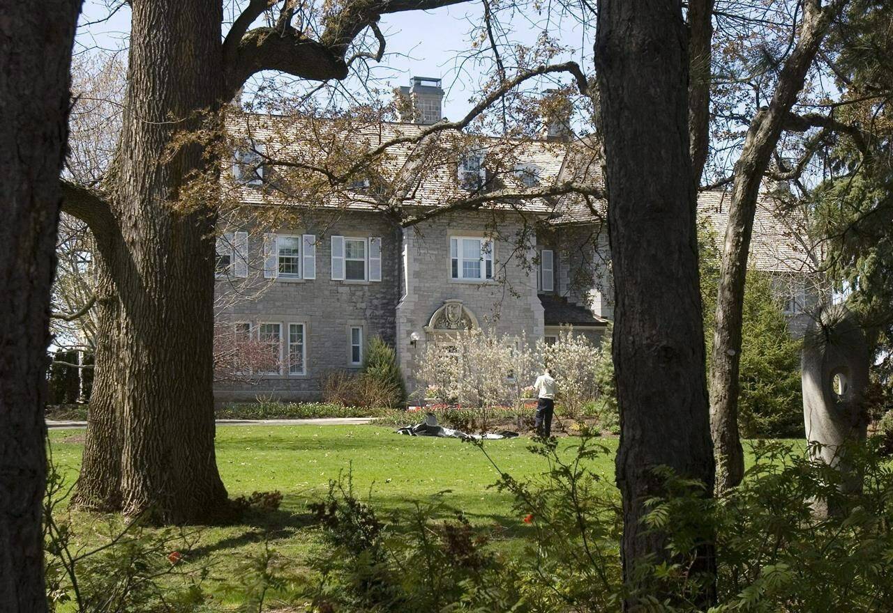 A gardener works on the grounds at the Prime Minister’s residence at 24 Sussex Drive in Ottawa, Tuesday May 6, 2008. Turning Rideau Cottage into the permanent residence of the prime minister would come at the cost of creating staff offices and other “residential infrastructure,” an internal government document says. THE CANADIAN PRESS/Tom Hanson