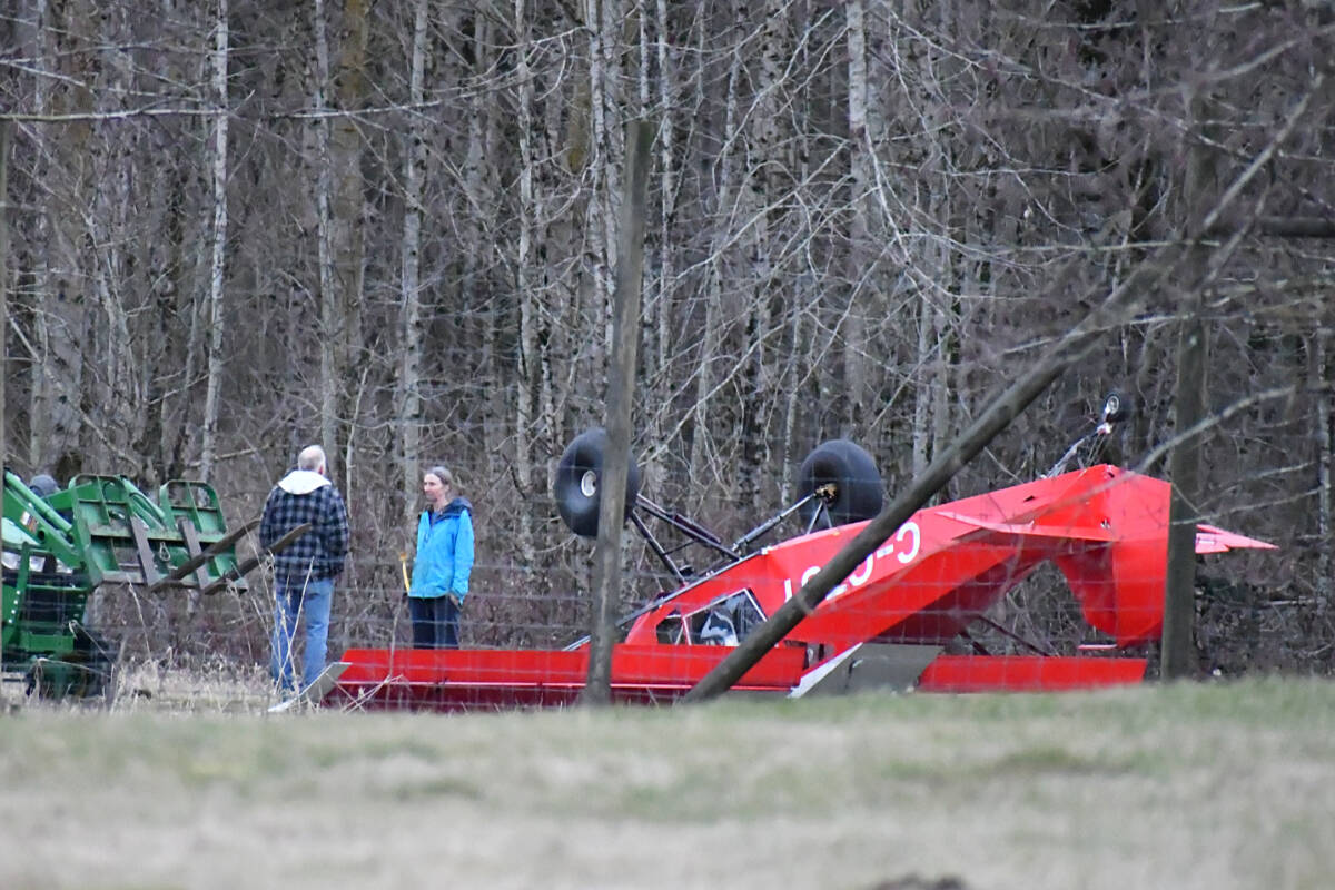 A small red plane wound up on its roof after a rough landing on a private runway on a rural property on 32nd Avenue in Langley on Monday, Feb. 5. (Matthew Claxton/Langley Advance Times)