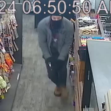 Prince George RCMP is looking for two suspects in an armed robbery who stole firearms from a gas station on Feb. 2, 2024. Only one of the suspects was caught of surveillance footage. (Prince George RCMP handout)
