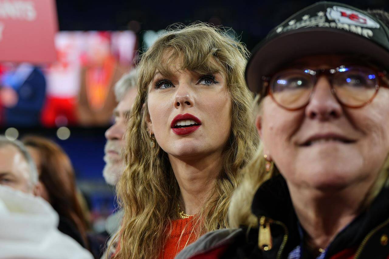 The Liberal government plans to ensure sexually explicit “deepfakes,” like the images of Taylor Swift that generated global headlines last month, are addressed by forthcoming legislation on online harms. Swift, left, is pictured here with Donna Kelce at the AFC Championship NFL football game, Sunday, Jan. 28, 2024, in Baltimore. THE CANADIAN PRESS/AP-Julio Cortez