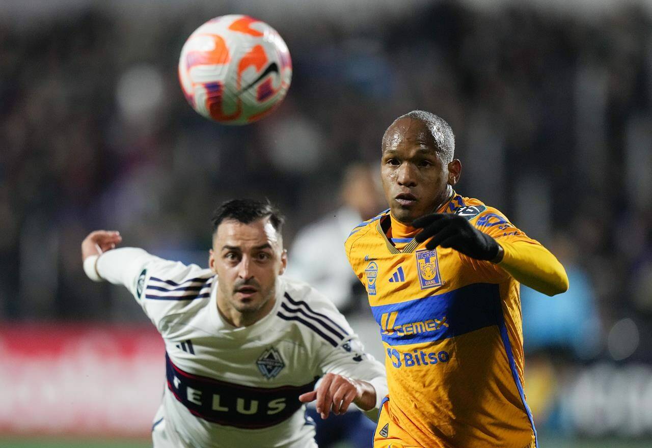 Tigres UANL’s Luis Quinones, front right, and Vancouver Whitecaps’ Luis Martins vie for the ball during the first half of a CONCACAF Champions Cup soccer match, in Langford, B.C., on Wednesday, February 7, 2024. THE CANADIAN PRESS/Darryl Dyck