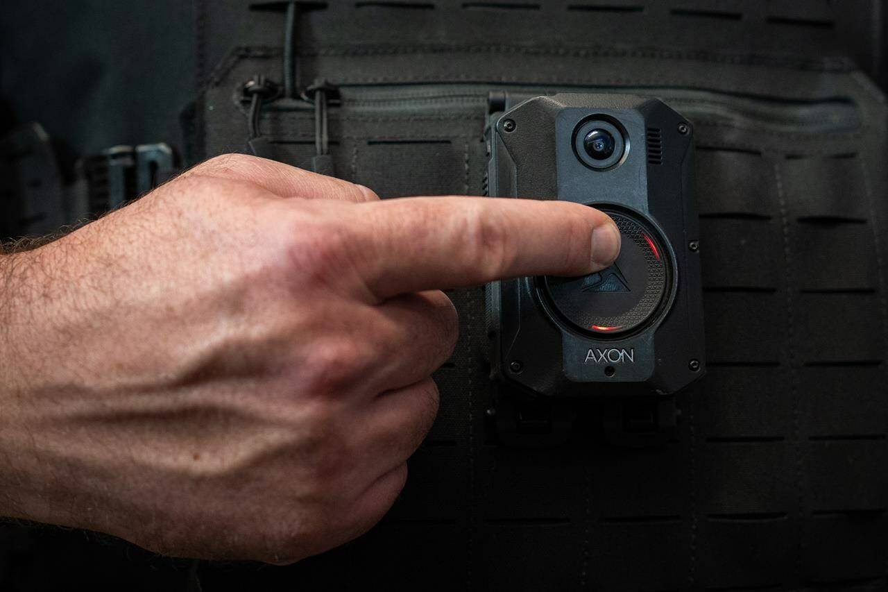 A Delta Police Department officer demonstrates recording on a body camera during a news conference by the B.C. Association of Chiefs of Police about implementing body-worn cameras for officers, in Surrey, B.C., on Thursday, Jan. 11, 2024. THE CANADIAN PRESS/Ethan Cairns