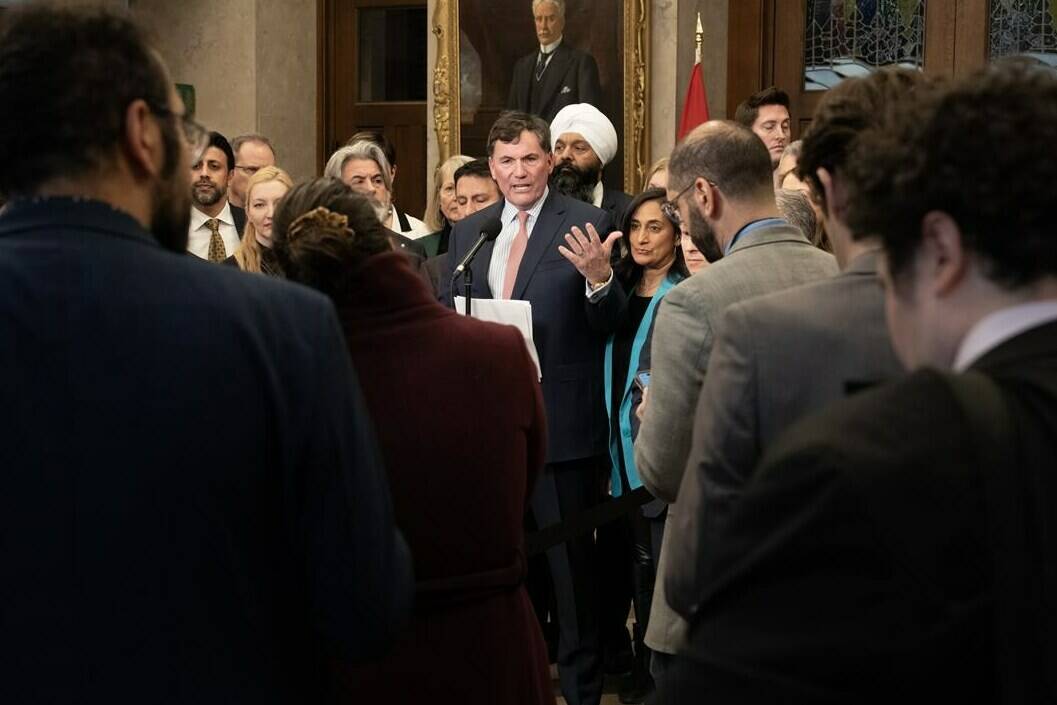 Reporters, staffers and Members of Parliament listen to Minister of Public Safety, Democratic Institutions and Intergovernmental Affairs Dominic LeBlanc speak about auto theft, Wednesday, February 7, 2024 in Ottawa. The federal government says an estimated 90,000 cars are stolen annually in Canada, resulting in about $1 billion in costs to Canadian insurance policy-holders and taxpayers. THE CANADIAN PRESS/Adrian Wyld