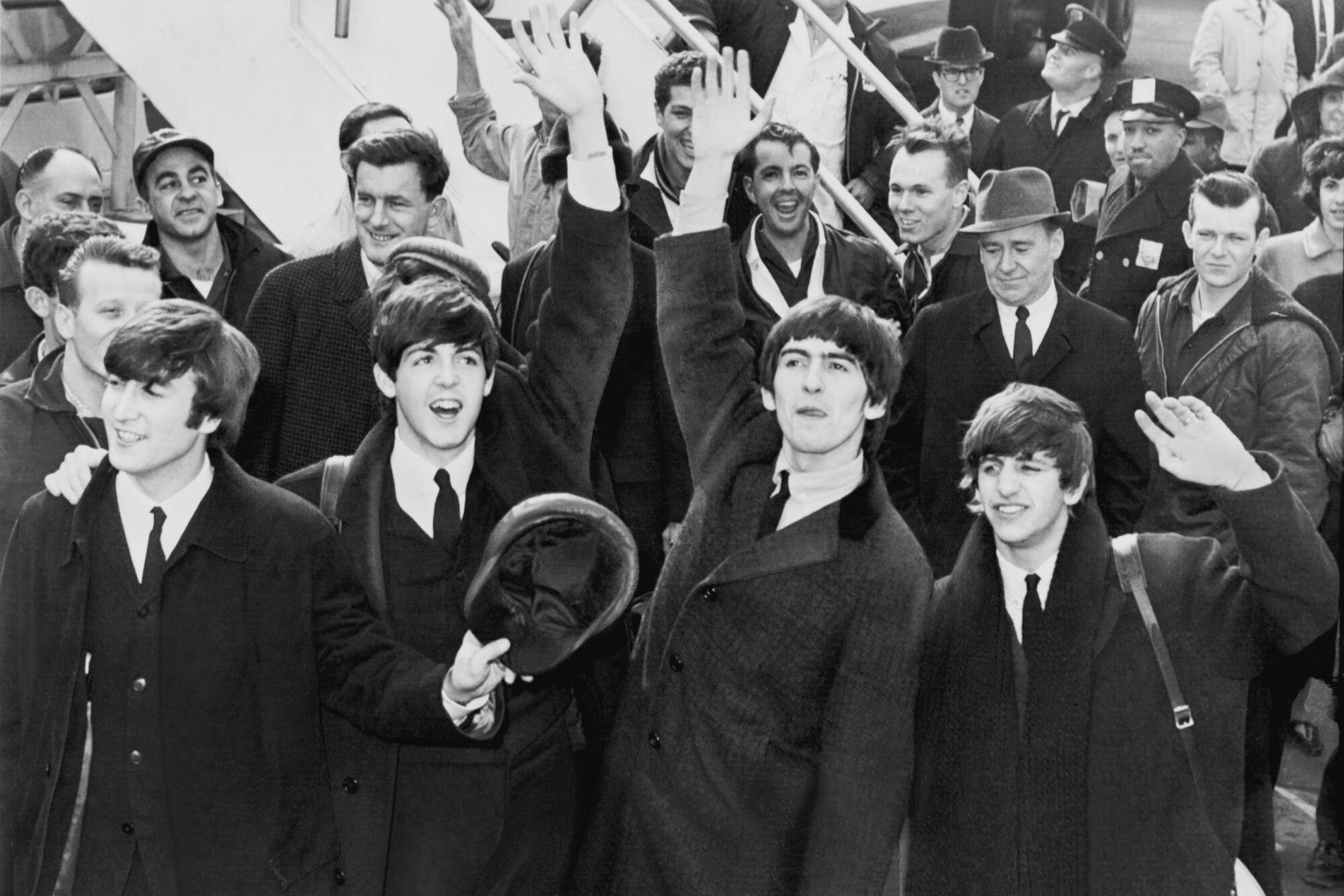 The Beatles arrive in New York in 1964. On Feb. 9 of that year, the Beatles made their first television appearance in North America. (UPI photo via Wikimedia Commons)