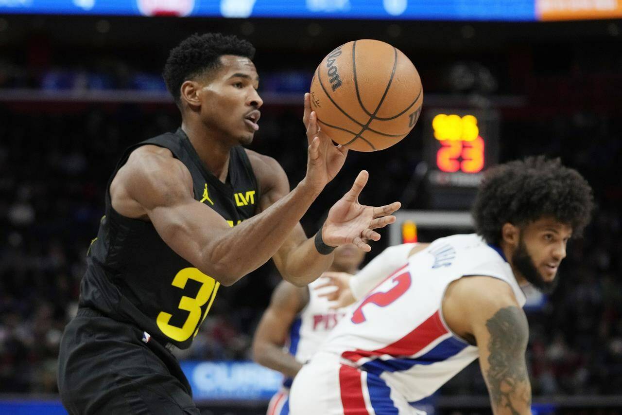 Utah Jazz guard Ochai Agbaji grabs a rebound during the first half of an NBA basketball game against the Detroit Pistons, Thursday, Dec. 21, 2023, in Detroit. Agbaji and Canadian centre Kelly Olynyk are coming to the Toronto Raptors. THE CANADIAN PRESS/AP-Carlos Osorio