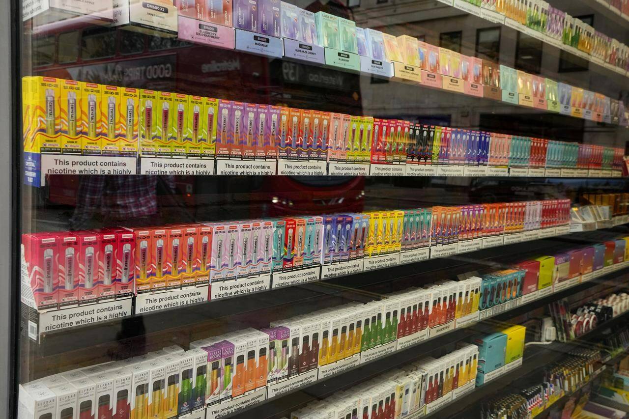 A major Canadian tobacco company says it is “extremely disappointed” in British Columbia’s decision to move the sale of flavoured nicotine pouches behind pharmacy counters. A selection of colourful disposable vapes on display for sale in a souvenir shop in London, Monday, Jan. 29, 2024. THE CANADIAN PRESS/AP-Kirsty Wigglesworth