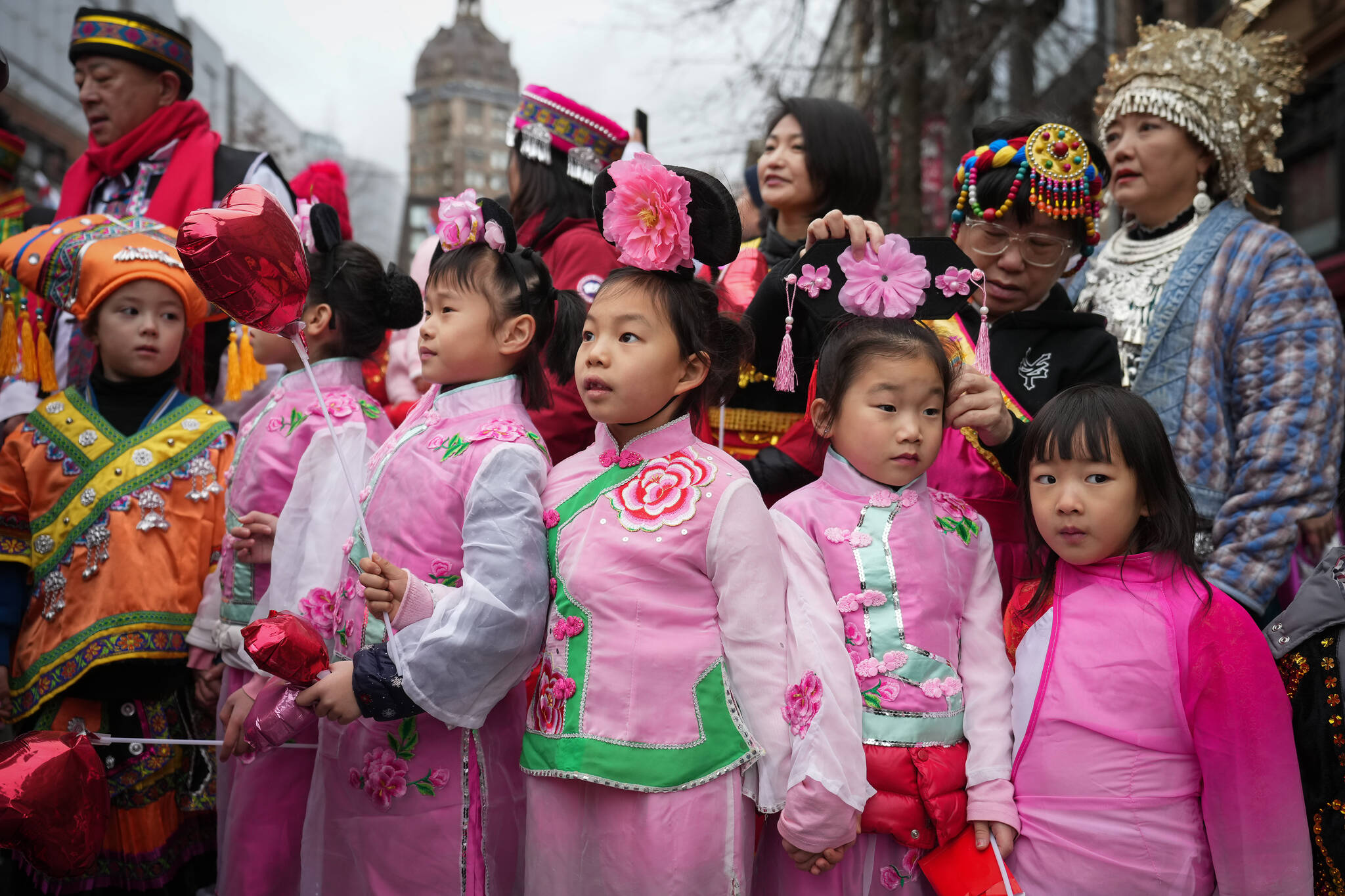 Young girls wait to participate in the Lunar New Year parade, in Vancouver, on Sunday, January 22, 2023. THE CANADIAN PRESS/Darryl Dyck