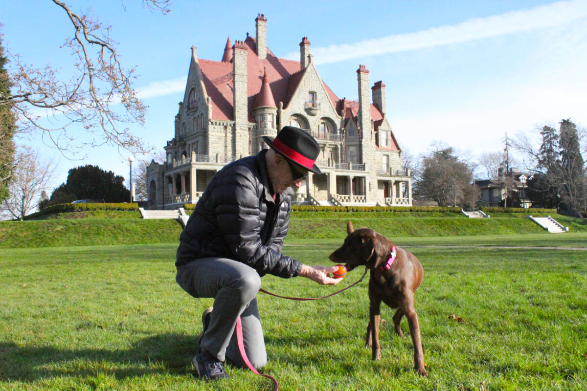 Colin Kingsford and his on leash dog Sydney take walks around Craigdarroch Castle. (Ella Matte/News Staff)