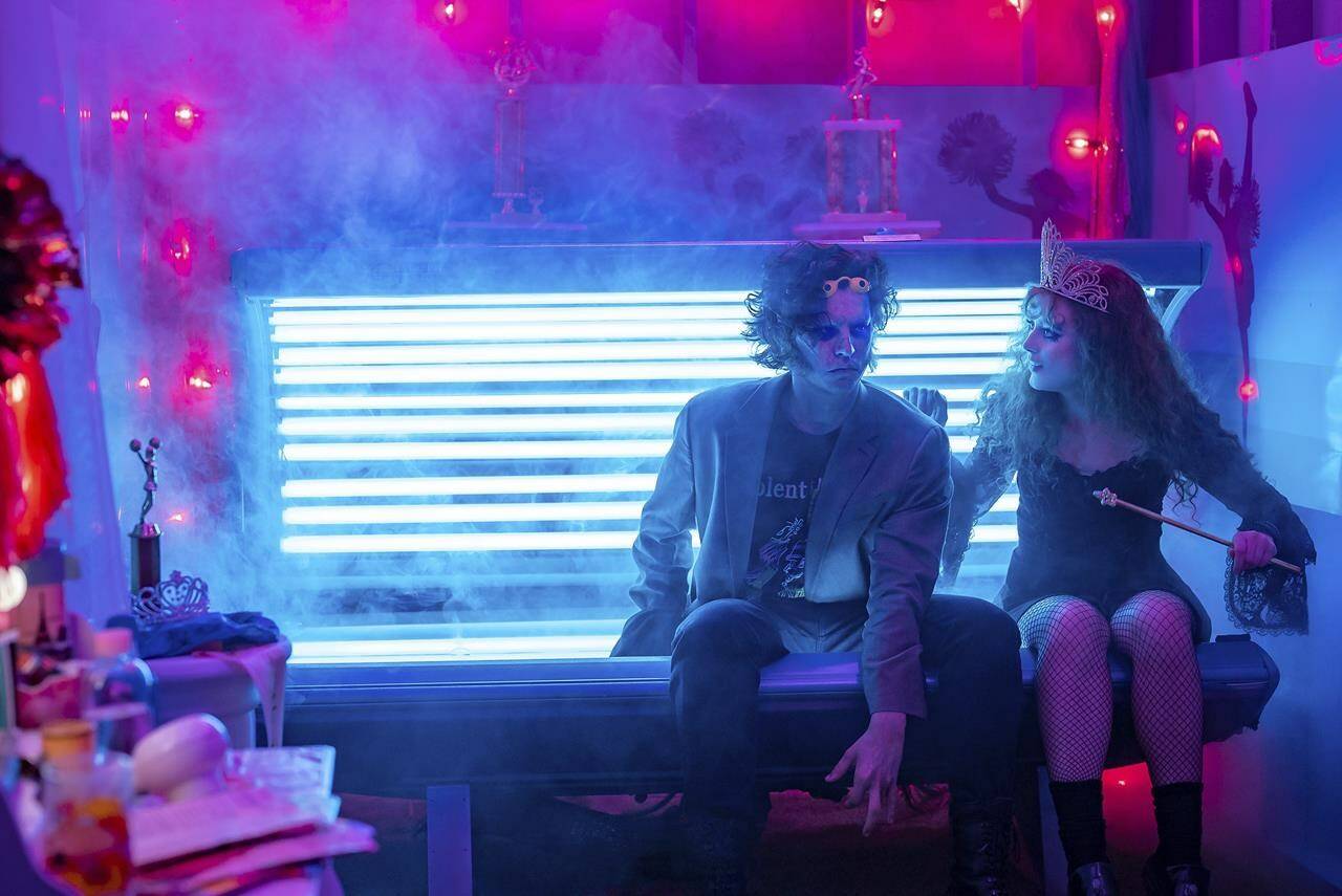 This image released by Focus Features shows Kathryn Newton, right, and Cole Sprouse in a scene from “Lisa Frankenstein.” (Michele K. Short/Focus Features via AP)