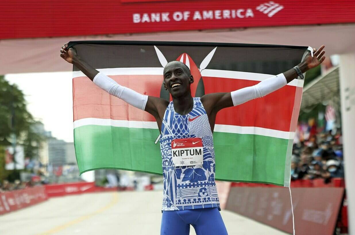 FILE - Kelvin Kiptum of Kenya celebrates his Chicago Marathon world record victory in Chicago’s Grant Park on Sunday, Oct. 8, 2023. According to a fellow athlete, Kiptum died in a car crash in Kenya late Sunday, Feb. 11, 2024. He was 24. (Eileen T. Meslar/Chicago Tribune via AP)