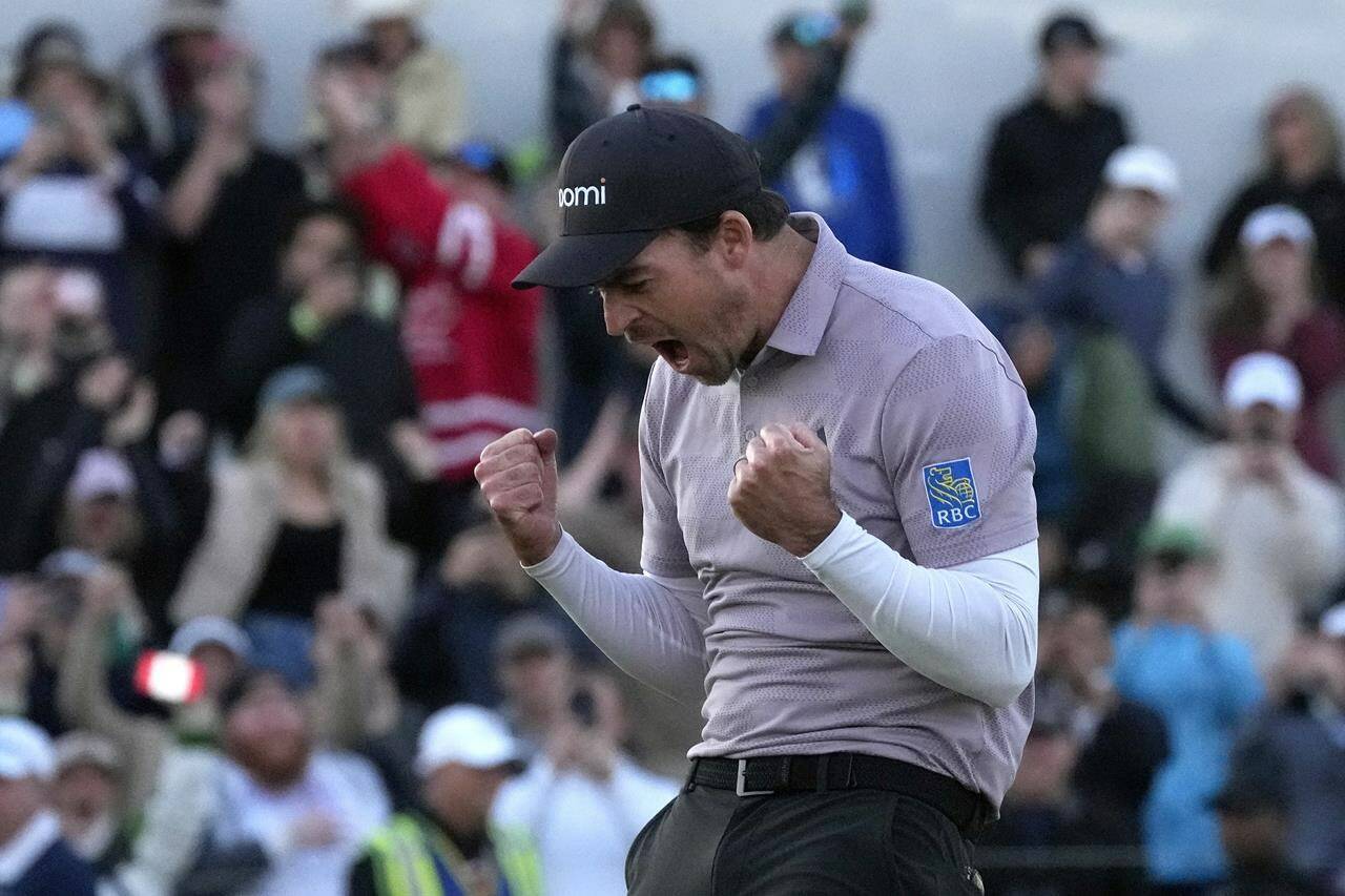 Nick Taylor, of Canada, celebrates his win over Charley Hoffman on the 18th green on the second playoff hole of the Phoenix Open golf tournament Sunday, Feb. 11, 2024, in Scottsdale, Ariz. (AP Photo/Ross D. Franklin)