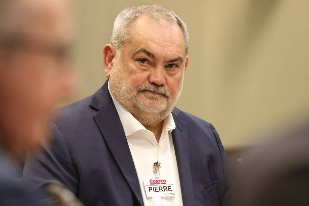 Pierre Riel, executive vice-president and chief operating officer of Costco Wholesale International and Canada, waits to appear as a witness at the Standing Committee on Agriculture and Agri-Food (AGRI) in Ottawa on Tuesday, Feb. 13, 2024. THE CANADIAN PRESS/ Patrick Doyle