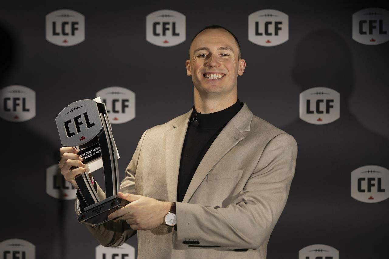 B.C. Lions’ Mathieu Betts with his award for the Most Outstanding Defensive Player at the 2023 Canadian Football League (CFL) Awards in Niagara Falls, Ont. Thursday, November 16, 2023. Betts, one of the CFL’s most coveted free agents, is returning to the NFL. THE CANADIAN PRESS/Tara Walton