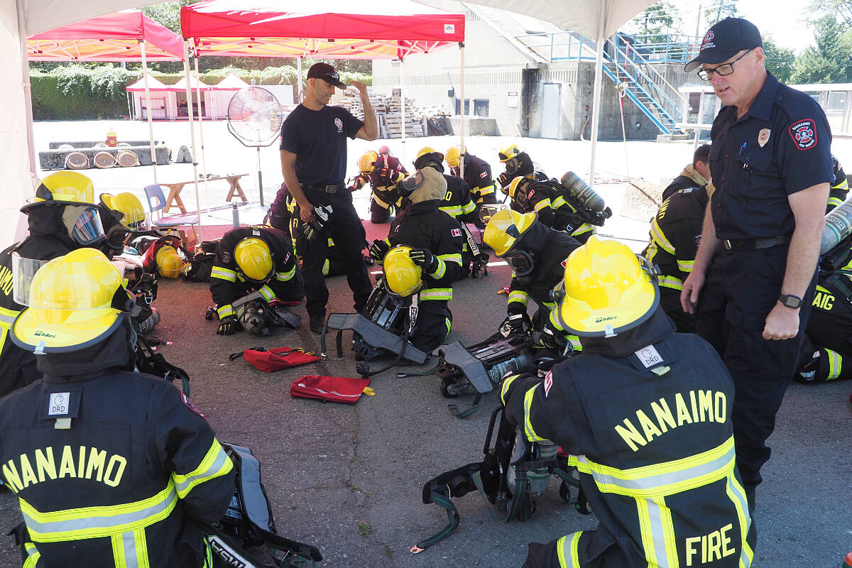 Nanaimo Fire Rescue recruits learn how to operate air packs Thursday, Aug. 3, at the Vancouver Island Emergency Response Academy training facility. The Fire Chiefs Association of BC is getting $1.75 million from the province to help create regional training hubs in nine communities throughout the province. (Chris Bush/News Bulletin)