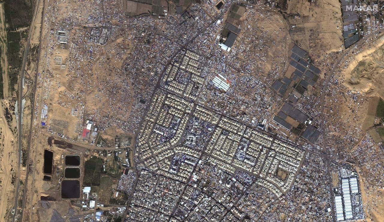 This satellite image provided by Maxar Technologies shows an overview of tents, shelters and people in Rafah, Gaza, Wednesday, Feb. 7, 2024. (Maxar Technologies via AP)