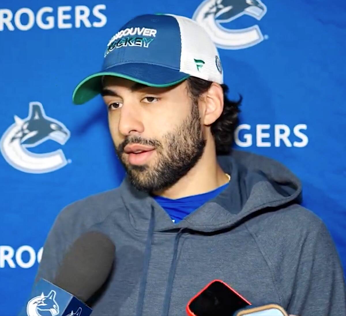 Surrey resident Arshdeep Bains talks to Vancouver Canucks beat reporters in Denver on Tuesday, Feb. 20, 2024, in video posted to twitter.com/canucks.