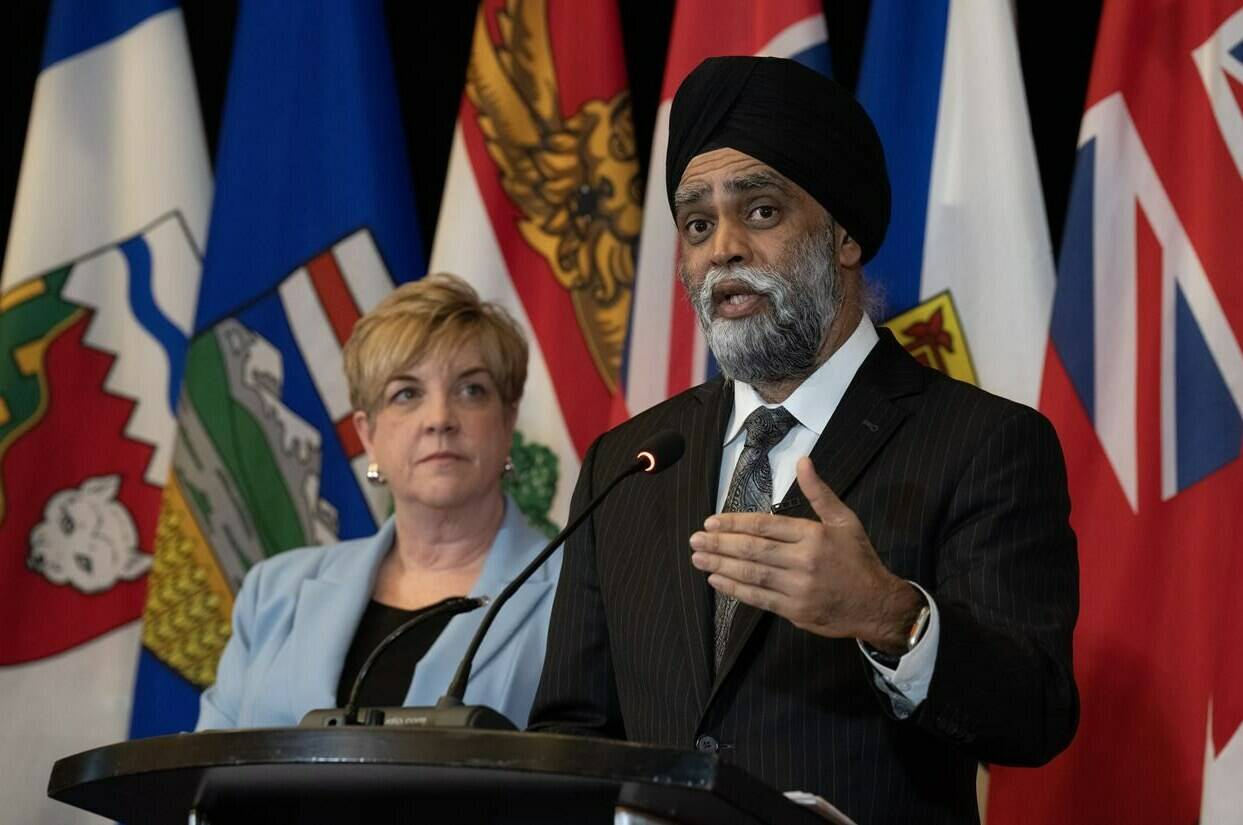 Manitoba Transport Minister Lisa Naylor listens as Minister of Emergency Preparedness Harjit Sajjan responds to a question during a news conference following meetings with provincial partners, Wednesday, February 21, 2024 in Ottawa. THE CANADIAN PRESS/Adrian Wyld