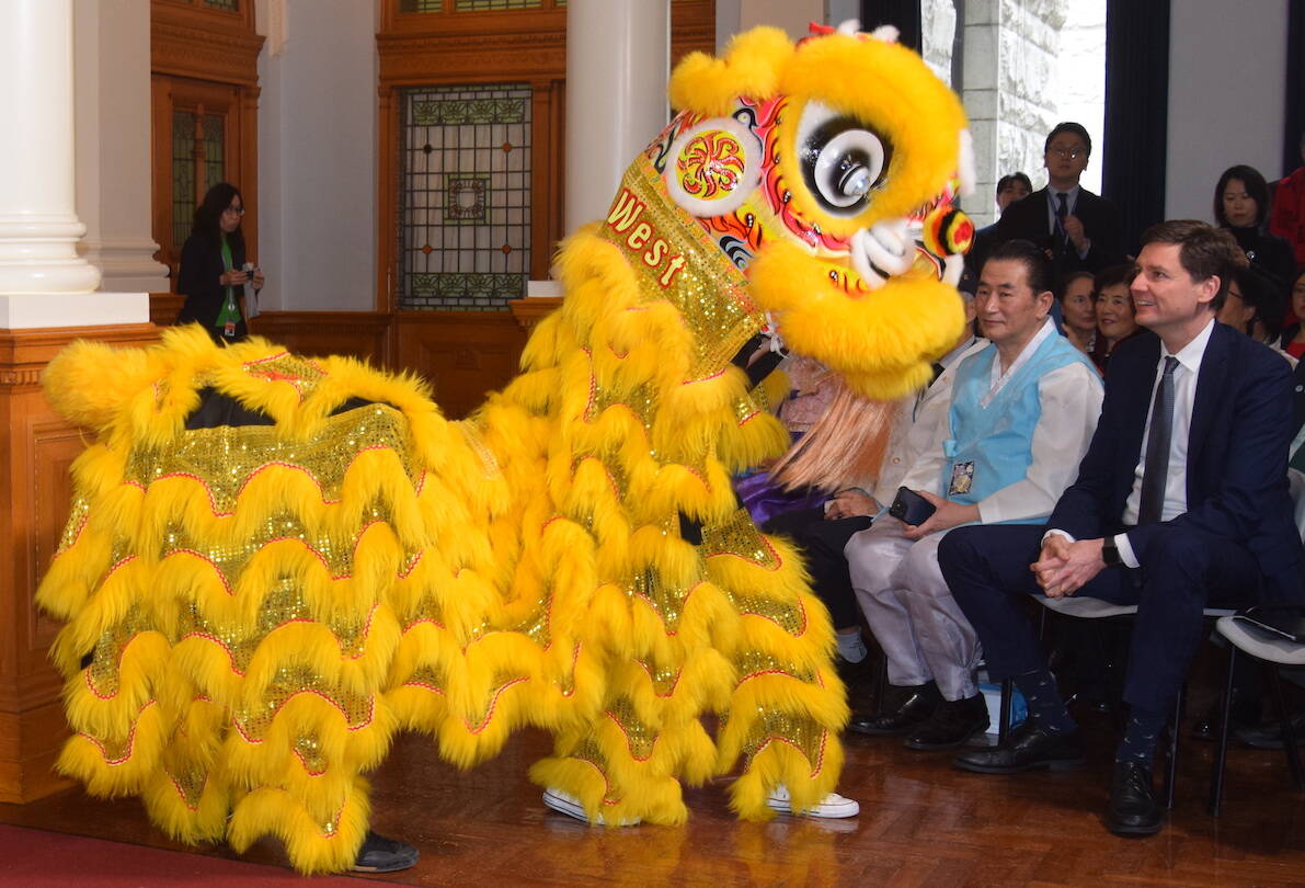 Premier David Eby watches the Ging Wu West Lion Dancers perform at a Lunar New Year celebration at the B.C. legislature on Wednesday (Feb. 21). (Brendan Mayer/News Staff)