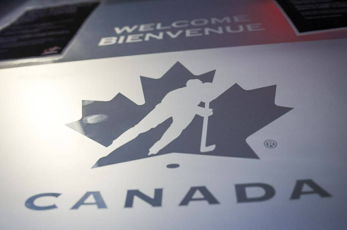 A Hockey Canada logo is seen on the door to the organizations head office in Calgary, Alta., Sunday, Nov. 6, 2022. Hockey Canada says Alberta will host the world junior hockey championship in 2027. THE CANADIAN PRESS/Jeff McIntosh