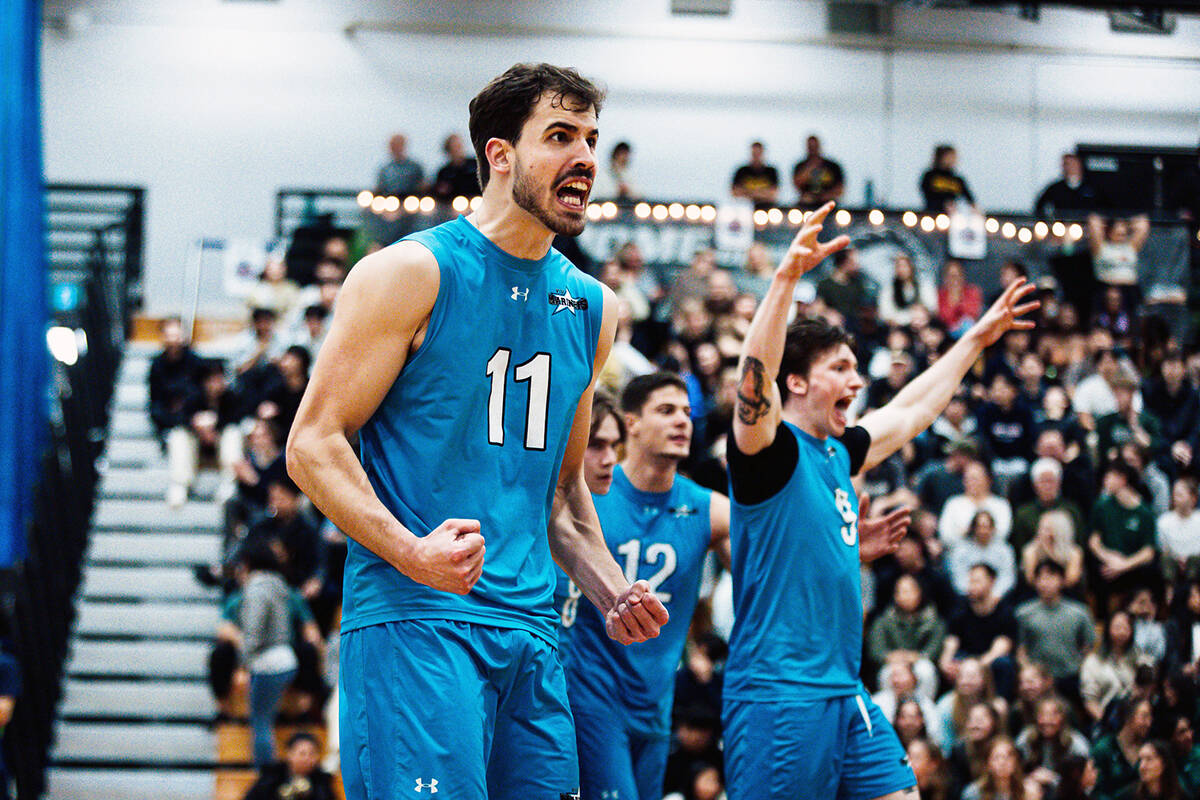 Vancouver Island University Mariners player Daniel Mascarenhas and his teammates celebrate a point during the PacWest championship match against the Douglas Royals in New Westminster on Saturday, Feb. 24. (James Glezos/PacWest)