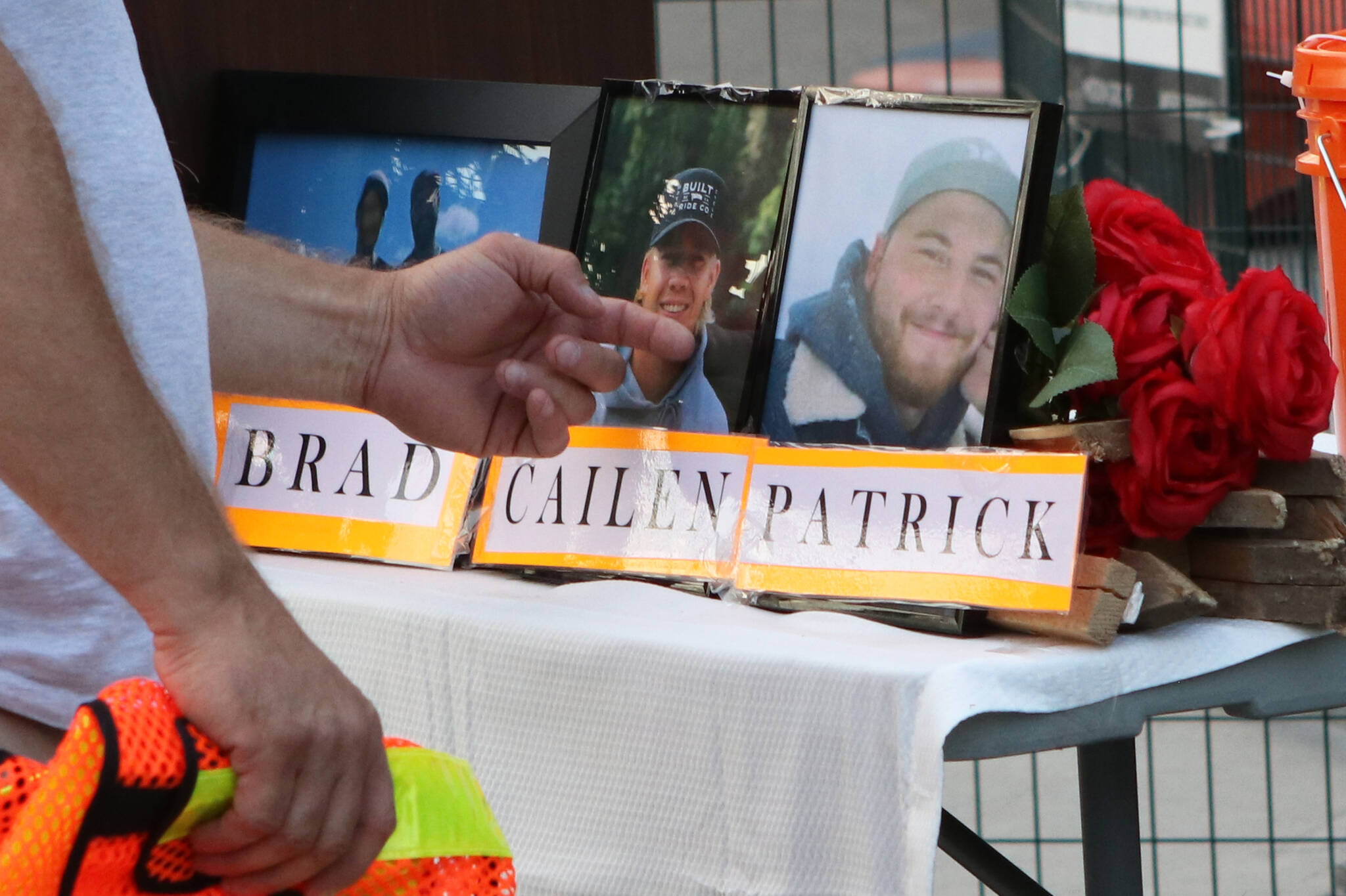 Friends and family members of the five men who died when a crane collapsed in downtown Kelowna on July 12 were joined by hundreds of people for a vigil that was hosted Friday, July 16, 2021, near the site of the collapse. (Aaron Hemens/Capital News)