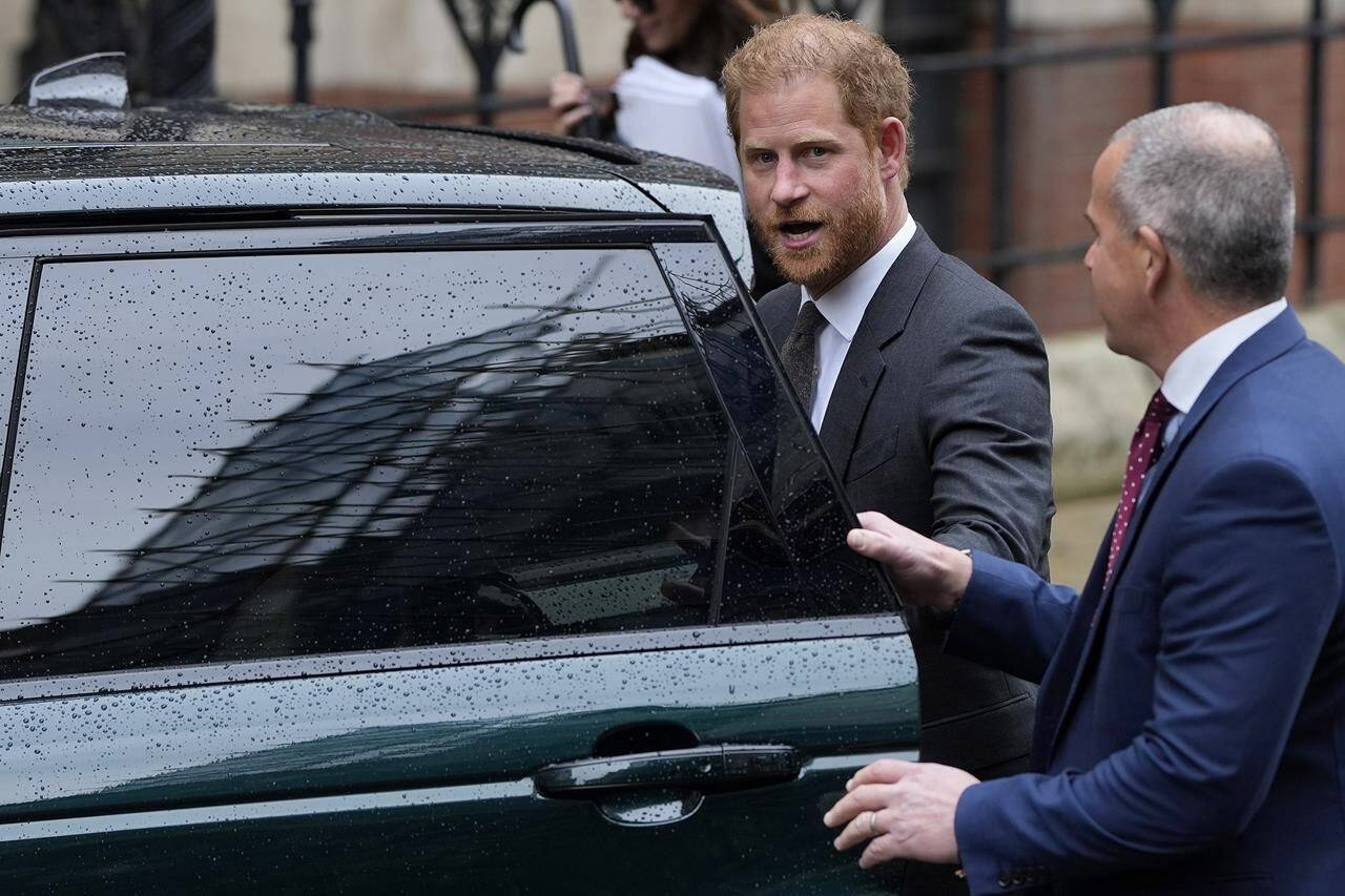 FILE - Britain’s Prince Harry leaves the Royal Courts Of Justice in London, Tuesday, March 28, 2023. Prince Harry was not improperly stripped of his publicly funded security detail during visits to Britain after he gave up his status as a working member of the royal family and moved to the U.S., a London judge ruled Wednesday Feb. 28, 2024. (AP Photo/Alastair Grant, File)