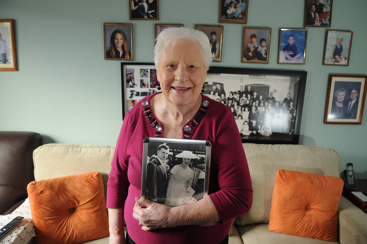 Isobel Boylan, seen holding her wedding photo in her Chilliwack home on Feb. 22, 2024, shared her leap year love story with The Chilliwack Progress. (Jenna Hauck/ Chilliwack Progress)