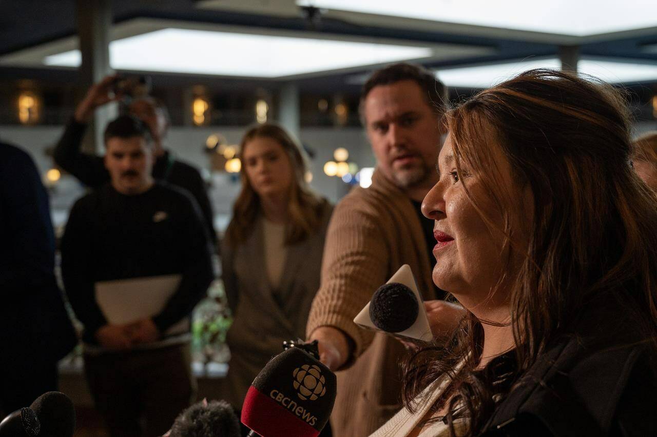 Vanessa Burns, who had been in a domestic partnership with Myles Sanderson for 14 years, speaks to media during an afternoon break at the inquest into the apprehension and death of Myles Sanderson, who killed 11 people and injured 17 others on James Smith Cree Nation and the nearby community of Weldon in September 2022, held at a hotel conference room in Saskatoon, Wednesday, February 28, 2024. THE CANADIAN PRESS/Liam Richards