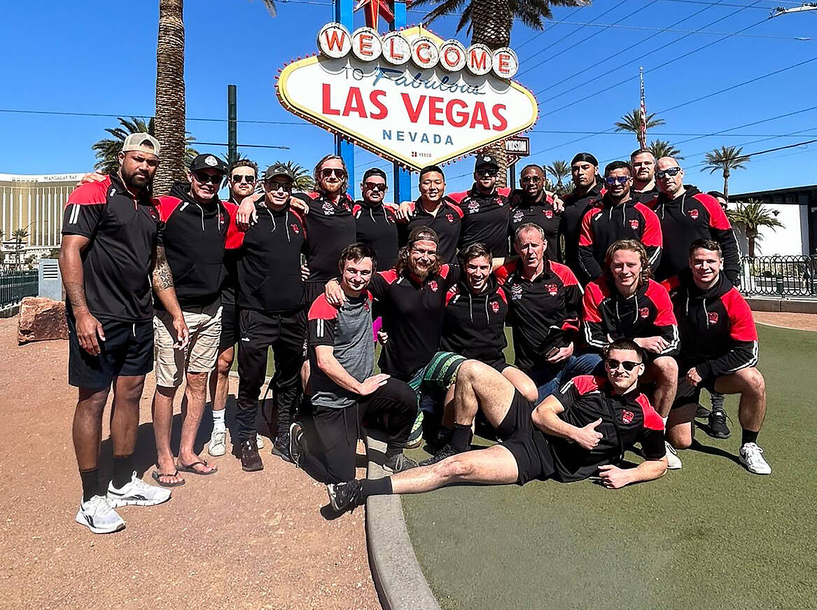 Members of the Canada Wolverines, the Canadian national rugby league team, pose in front of the Las Vegas sign on Wednesday Feb. 28, 2024 ahead of their international Friday against the USA Hawks. THE CANADIAN PRESS/HO-Canada Wolverines