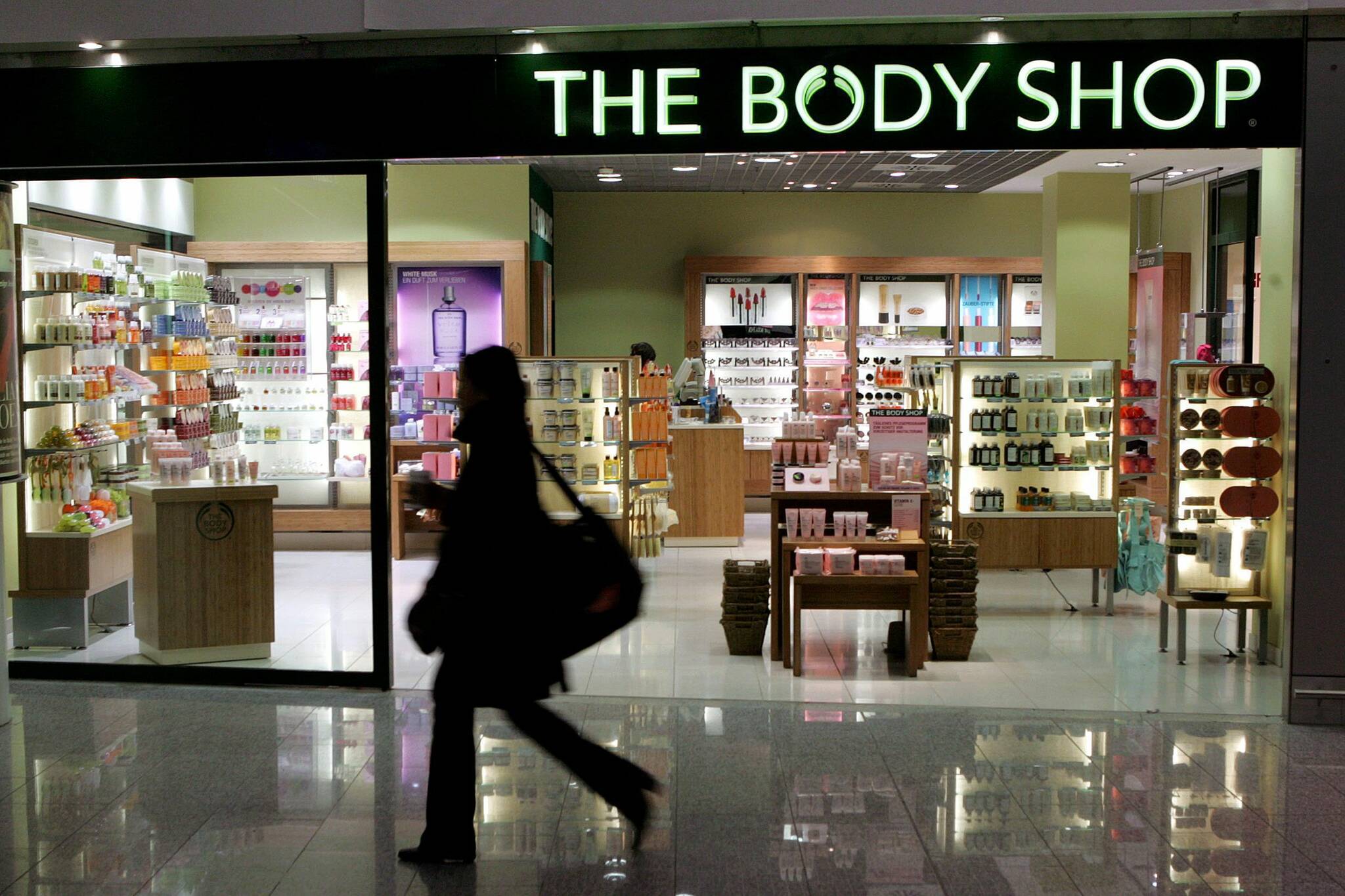 Body Shop Canada has filed for bankruptcy protection and is planning a restructuring. A woman passes a Body Shop cosmetics store at the airport in Frankfurt, central Germany, Friday, March 17, 2006. THE CANADIAN PRESS/AP/Michael Probst