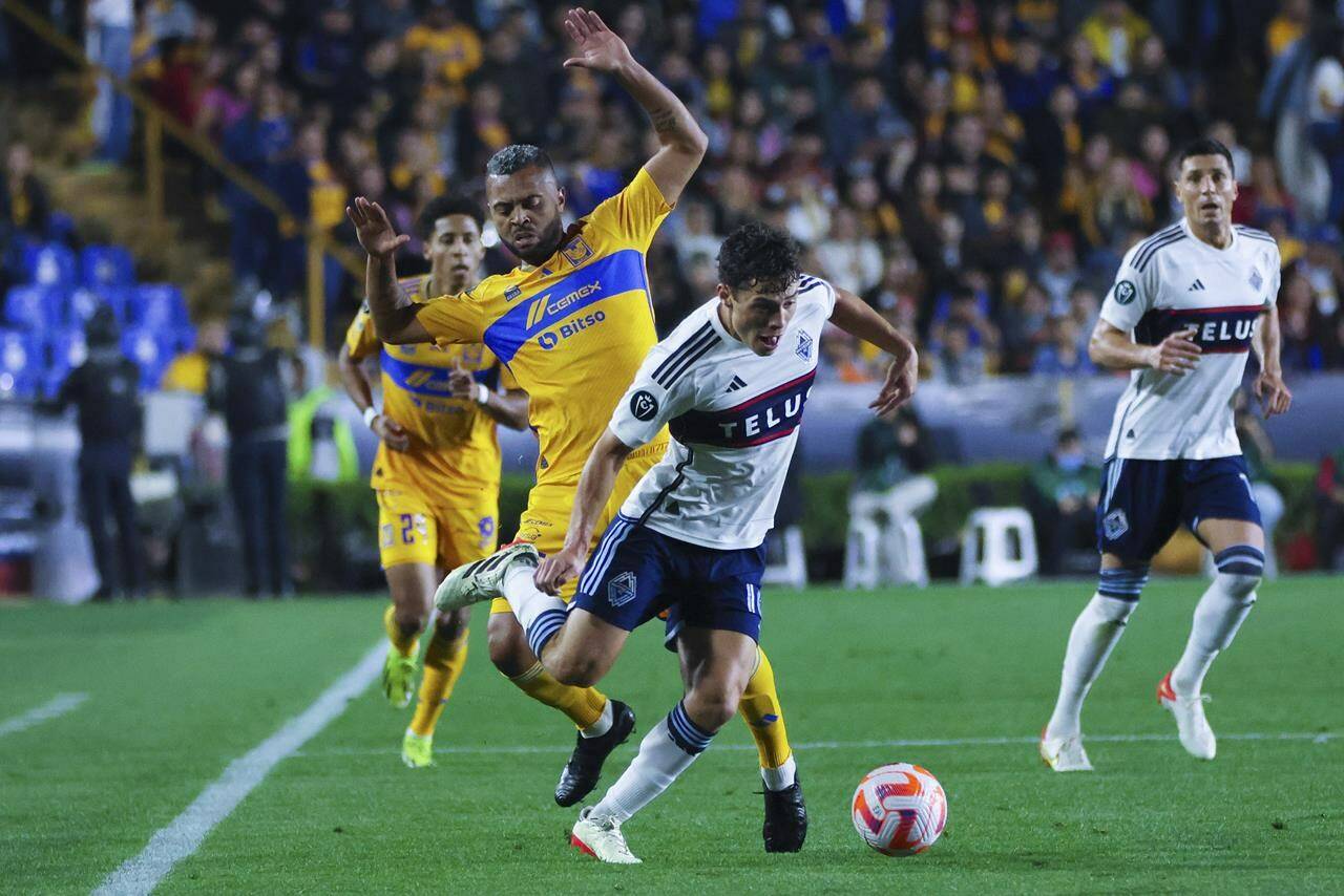 Rafael Carioca of Mexico’s Tigres, left, and Sebastian Berhalter of Canada’s Vancouver Whitecaps compete for the ball during a CONCACAF Champions Cup soccer match in Monterrey, Mexico, Wednesday, Feb. 14, 2024. A shortened pre-season due to CONCACAF Champions Cup action in January and February meant the Whitecaps were back on the field sooner than in previous seasons. THE CANADIAN PRESS/AP-Jorge Mendoza