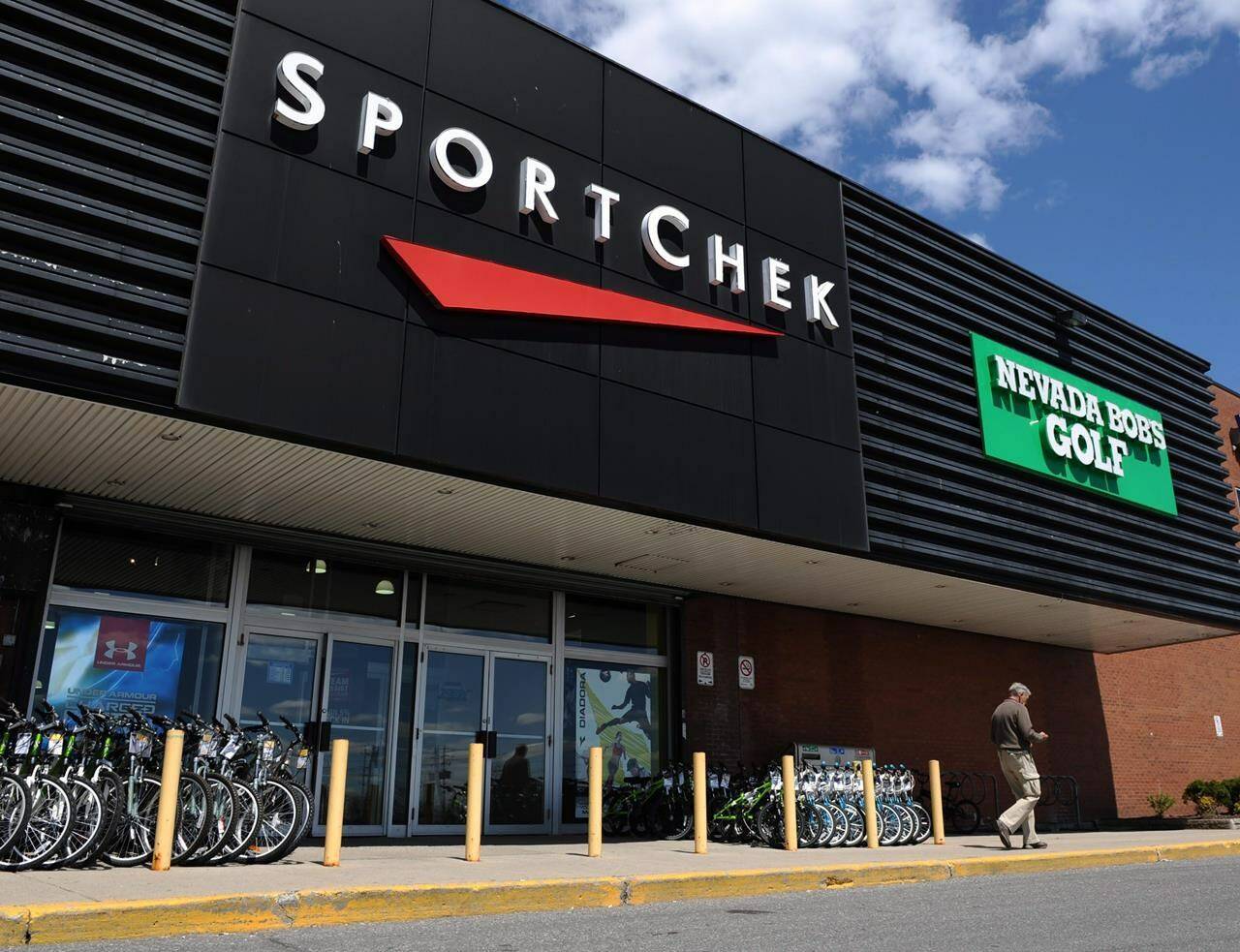 A customer leaves a SportChek and Nevada Bob’s Golf store in Ottawa on Monday, May 9, 2011. Despite an unseasonably warm winter, there’s a chill across the Canadian retail landscape. THE CANADIAN PRESS/Sean Kilpatrick